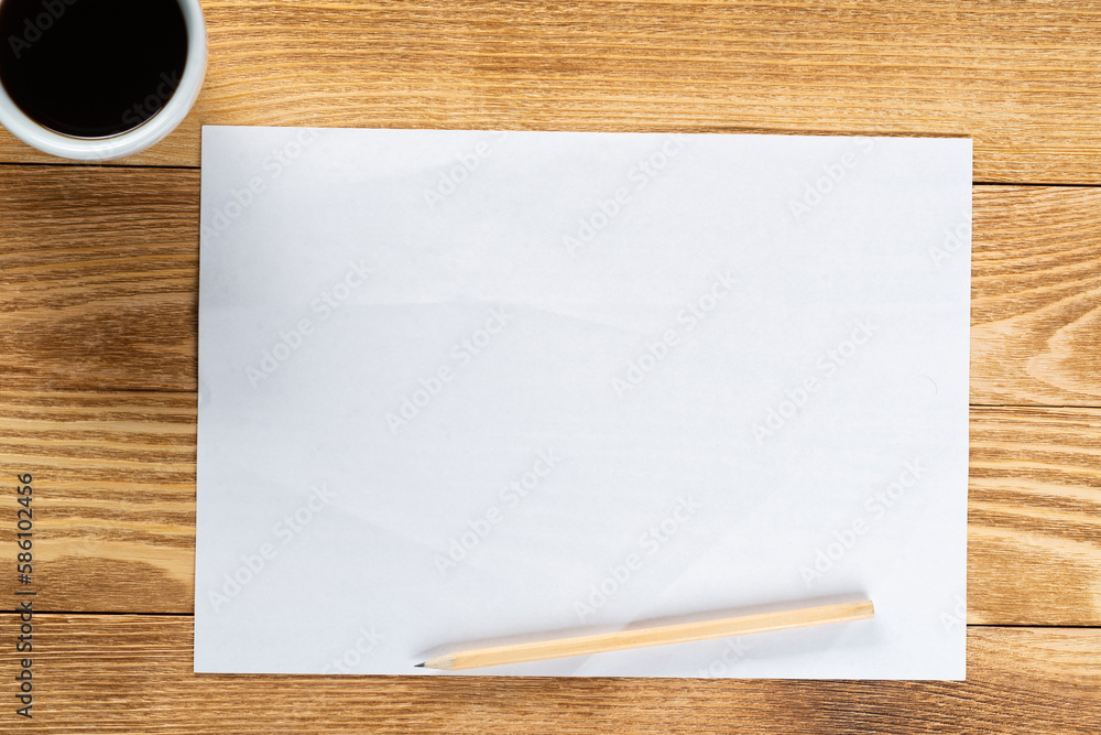 Sheet of paper lying on wooden table