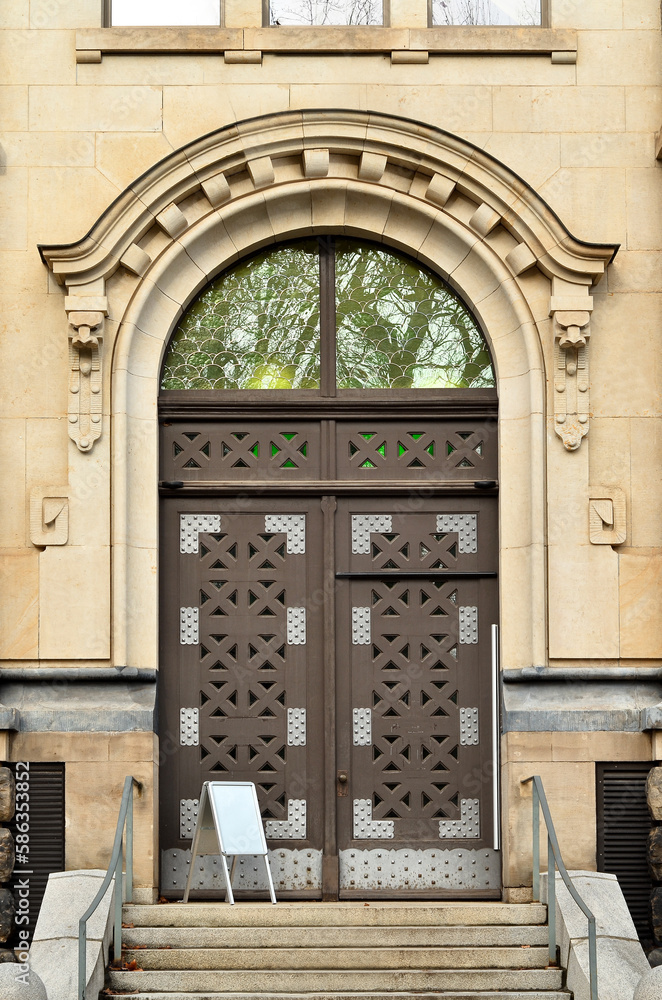 View of old building with wooden door