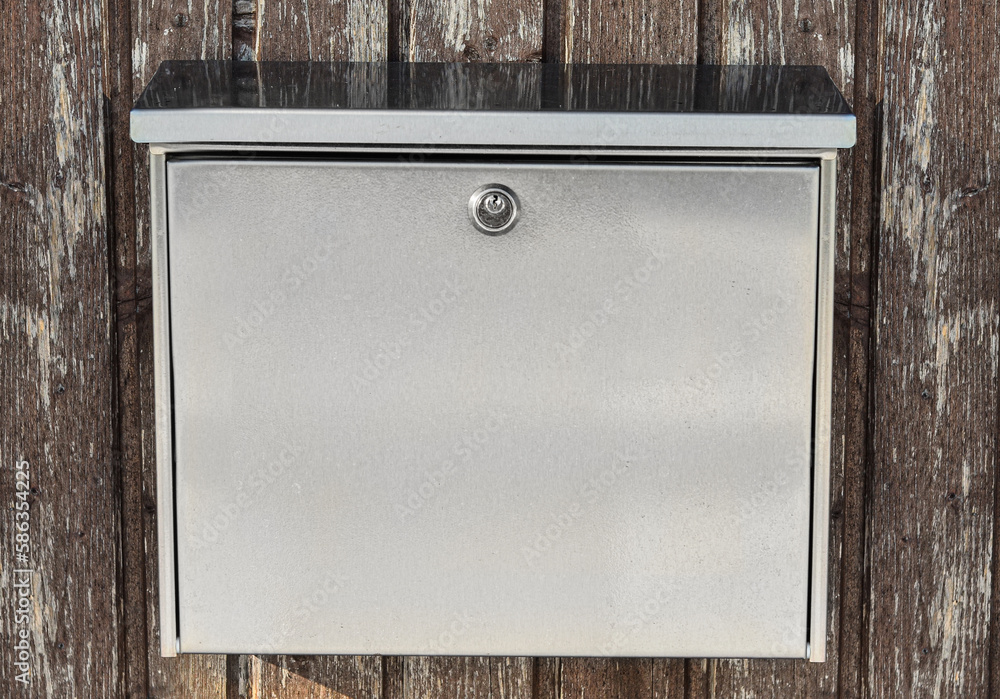 View of mailbox on wooden fence outdoors, closeup