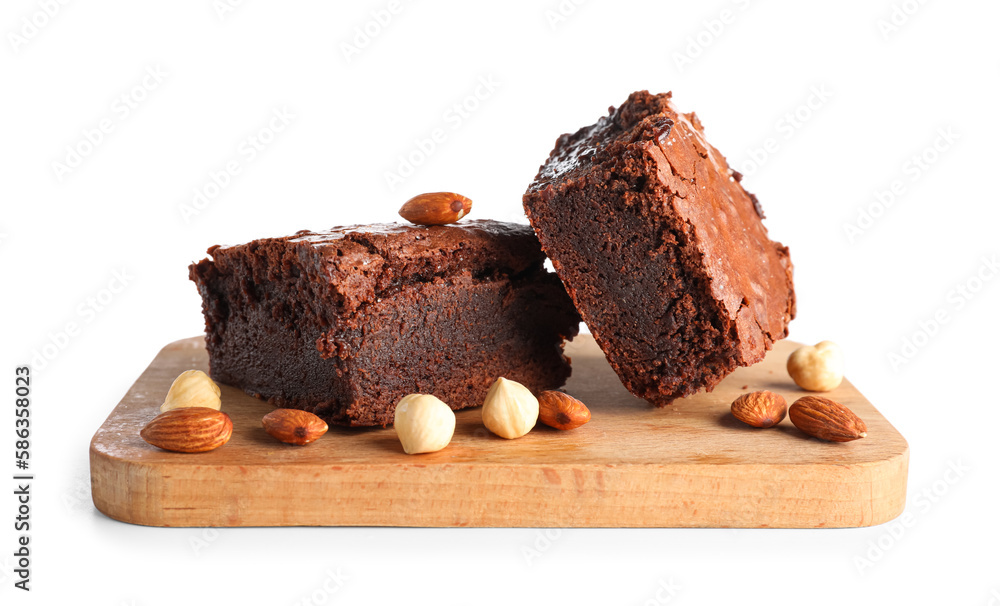 Wooden board with pieces of tasty chocolate brownie isolated on white background