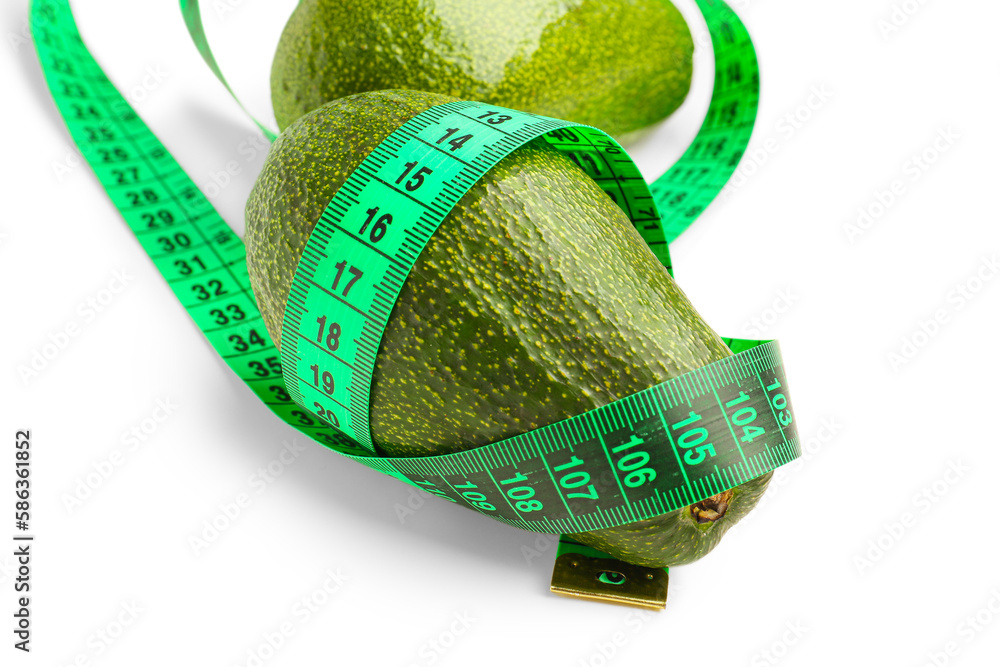 Avocados and green measuring tape on white background. Diet concept