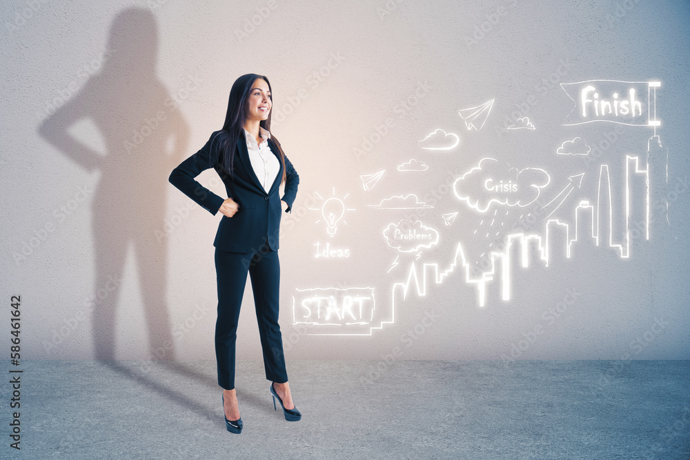 Attractive young european businesswoman standing on concrete wall background with creative business 