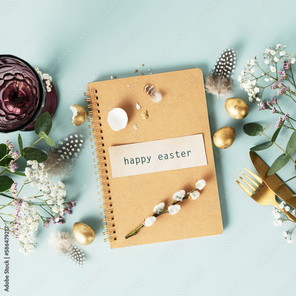 Easter table decorations. Happy Easter concept with white plate, golden easter eggs, feathers and sp