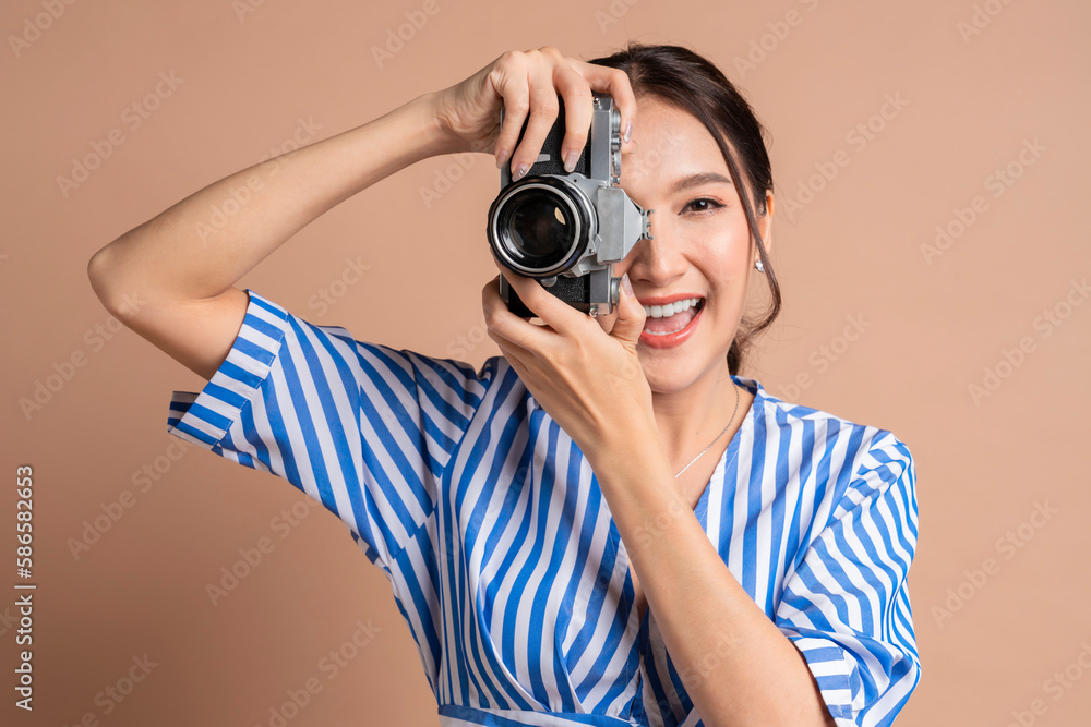 attractive asian female traveller woman enjoy photograph casual lifestyle,woman hold camera taking p