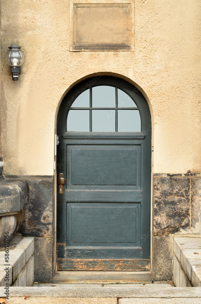 View of old building with wooden door