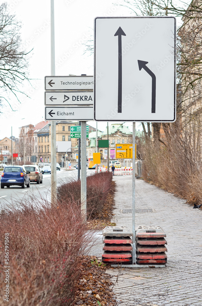 View of city street with direction signs