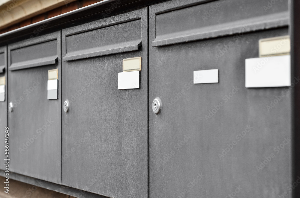 View of mailboxes on building wall, closeup