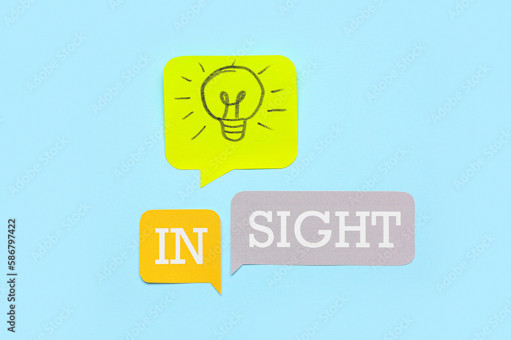 Speech bubbles with word INSIGHT and drawn light bulb on blue background