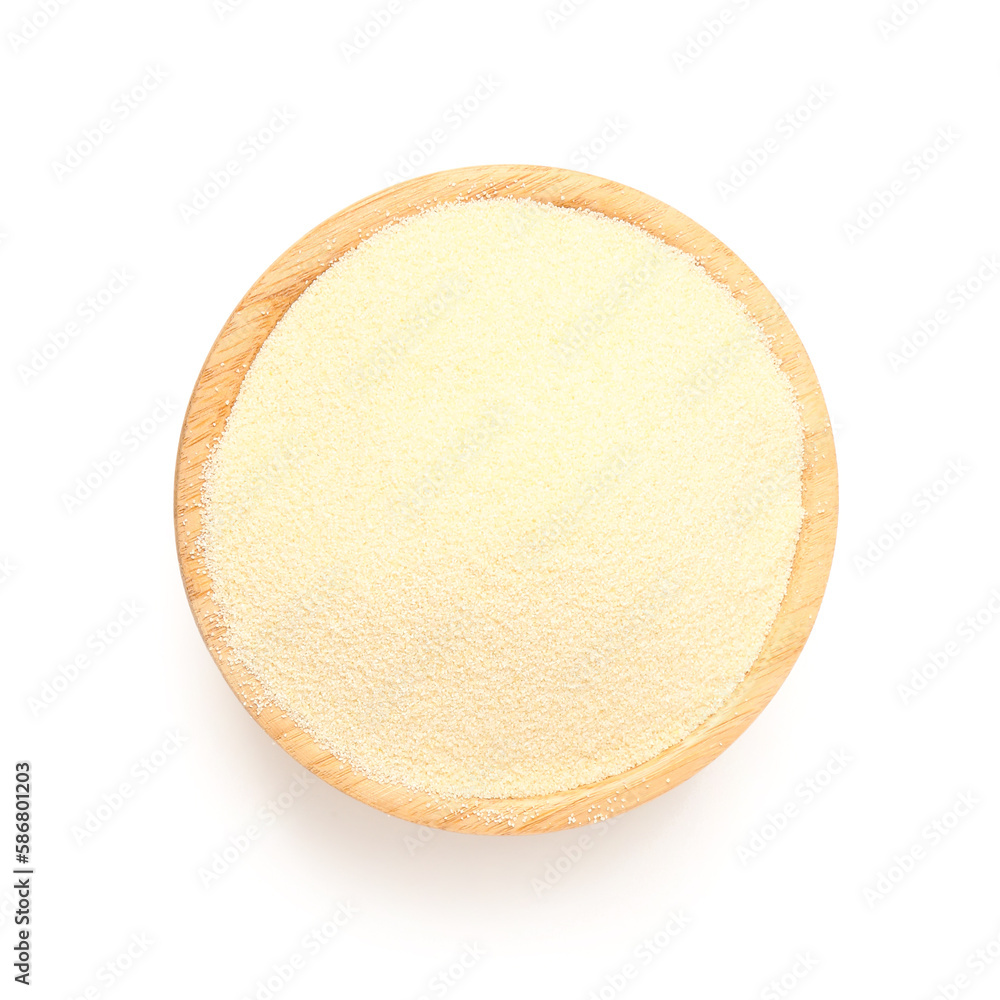 Bowl of raw semolina on white background