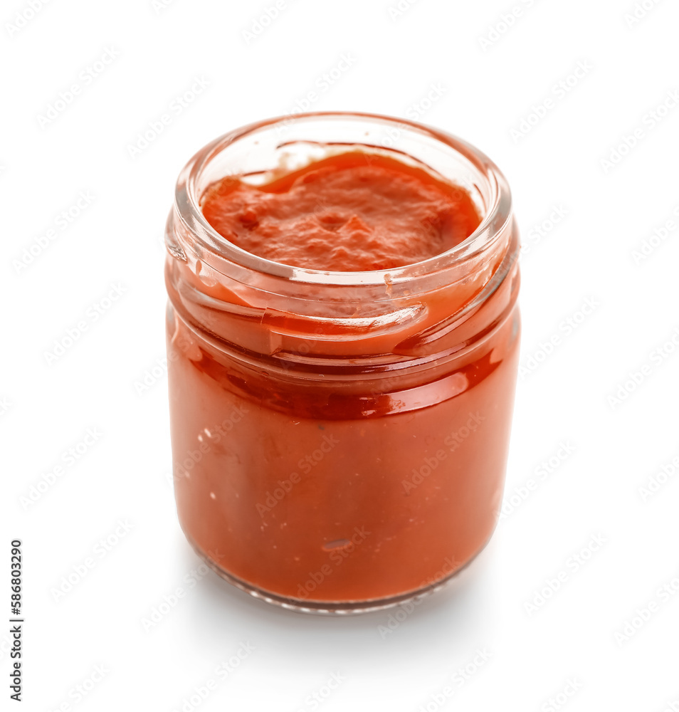 Jar with tasty tomato paste on white background