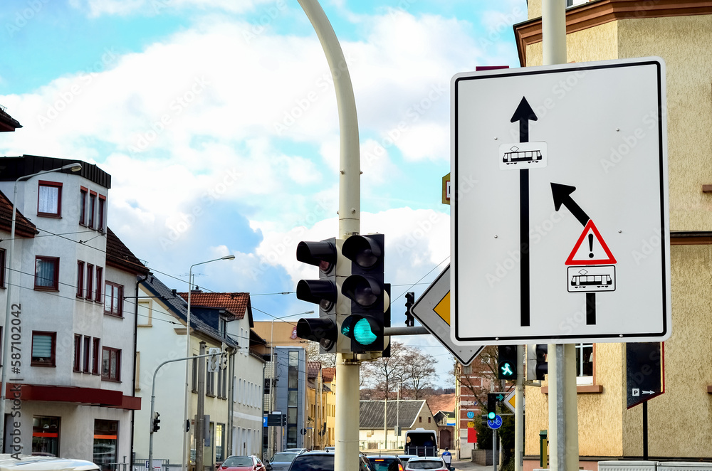 View of road signs and traffic lights in city