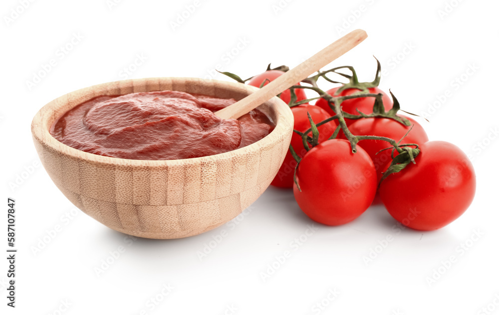 Bowl with tasty tomato paste and fresh vegetables on white background