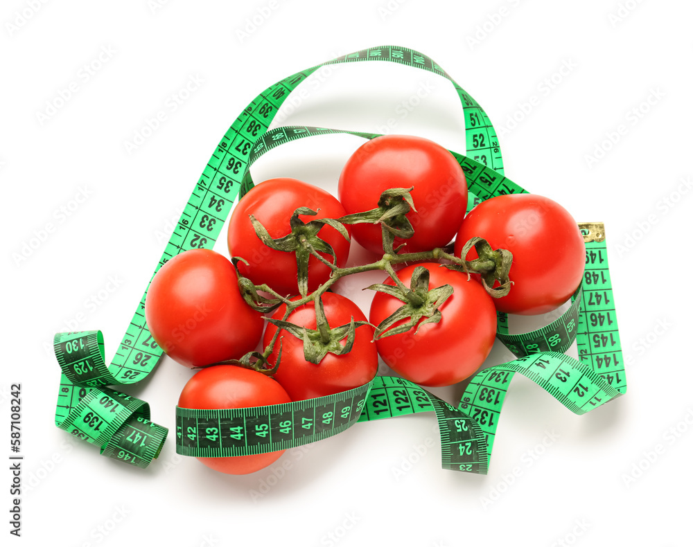 Tomatoes and green measuring tape on white background. Diet concept