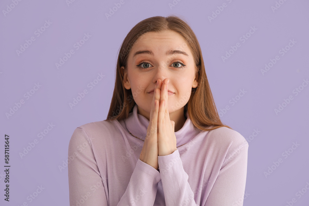 Happy young woman in sweater on lilac background, closeup