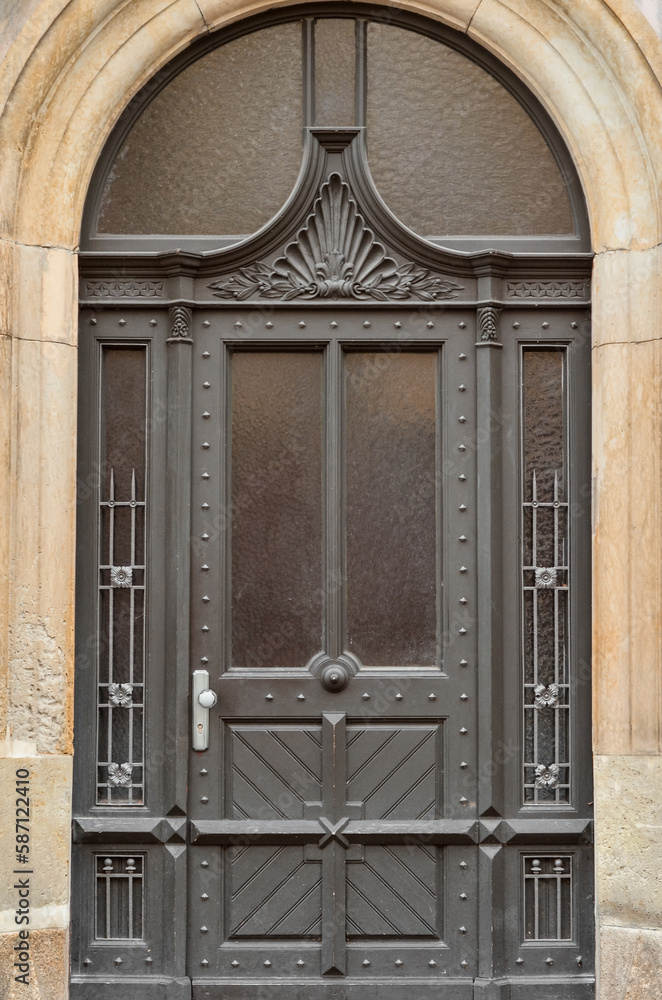 View of old building with black wooden door