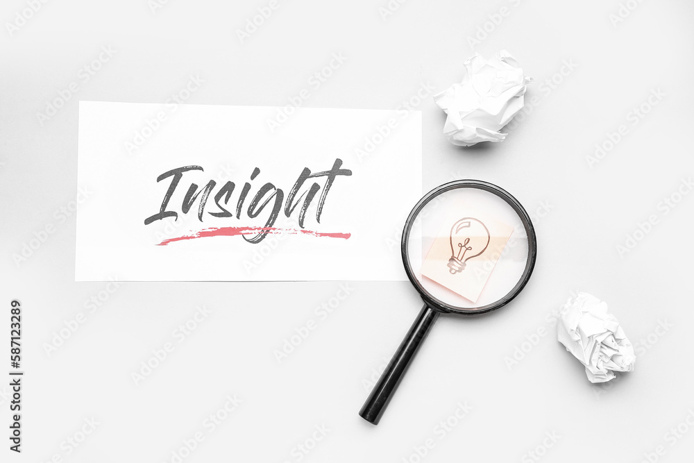 Word INSIGHT, crumpled paper, magnifier and drawn light bulb on light background