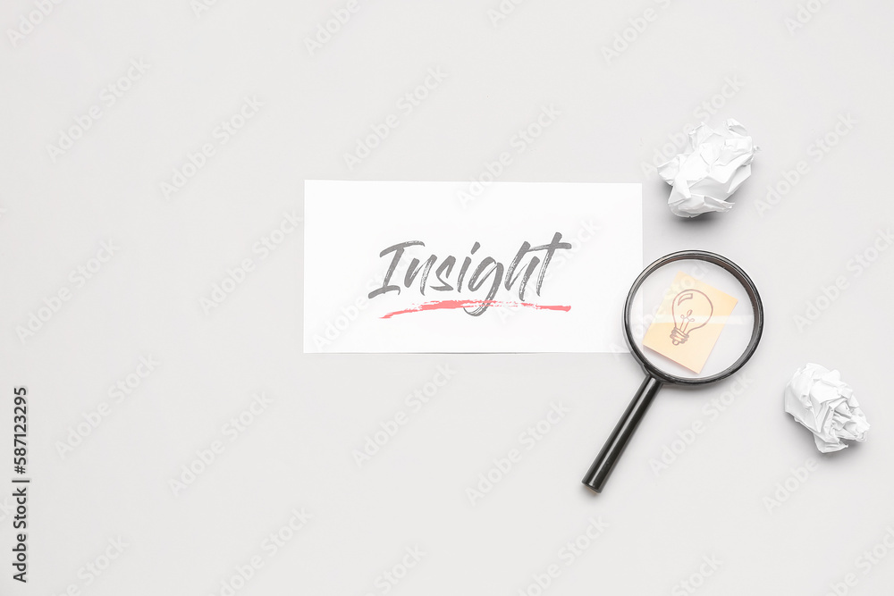 Word INSIGHT, crumpled paper, magnifier and drawn light bulb on light background