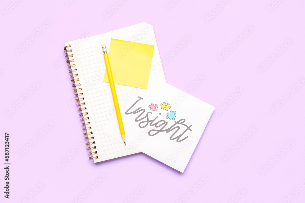 Paper with word INSIGHT, pencil and notebook on lilac background