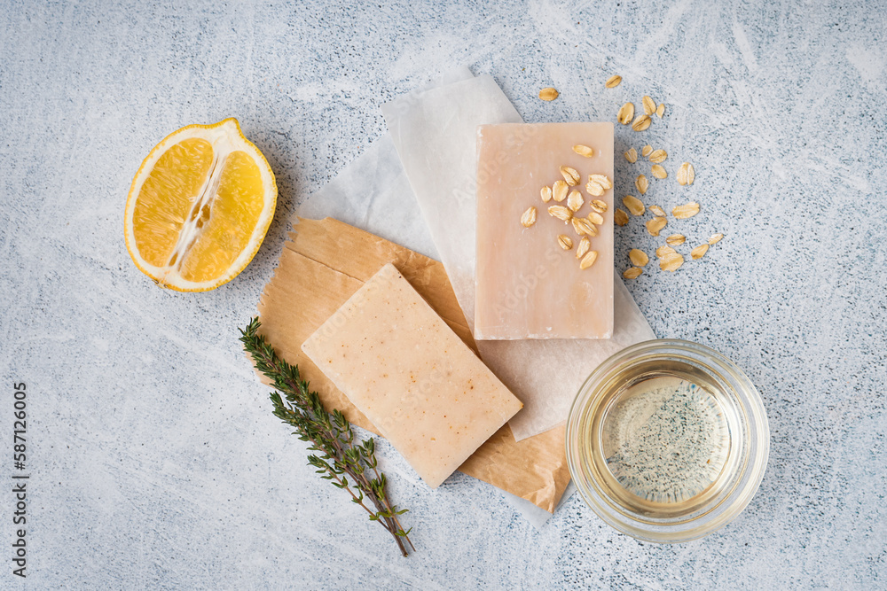 Composition with soap and natural ingredients on light background