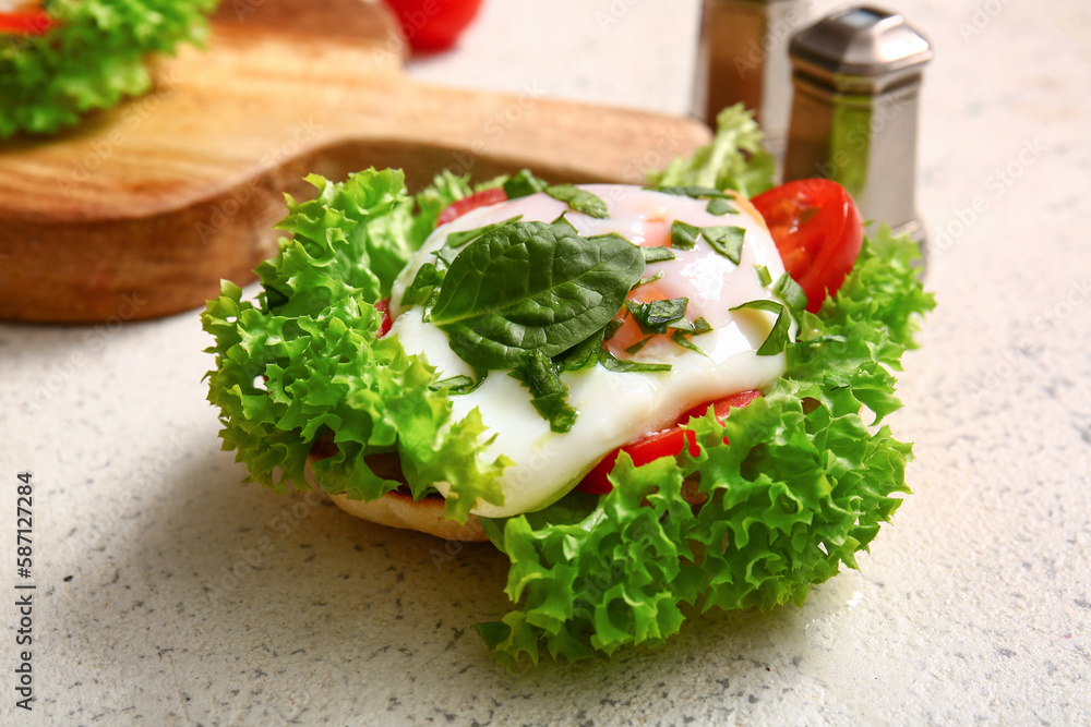 Delicious egg Benedict and vegetables on white table, closeup