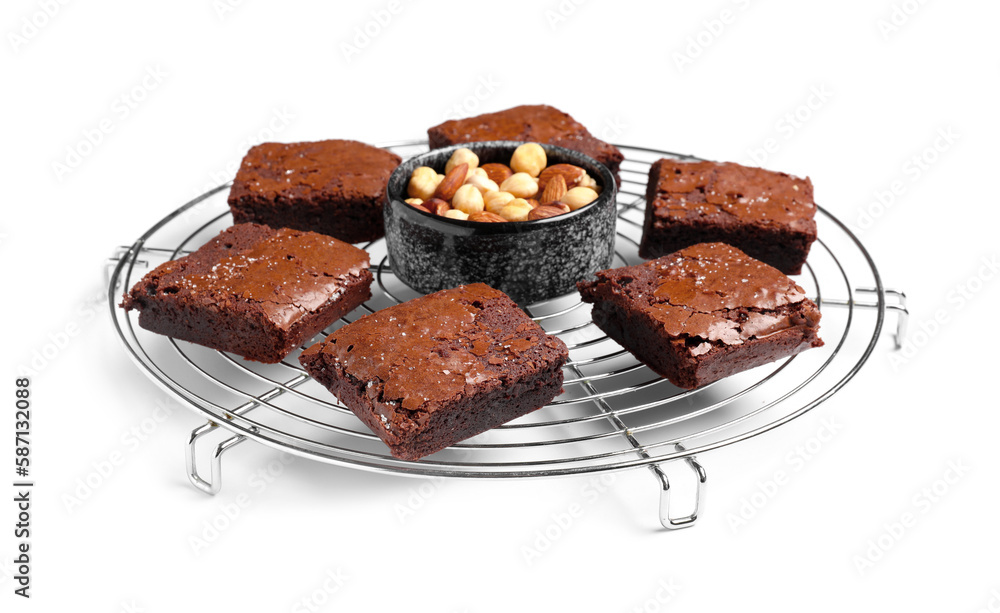 Grid with pieces of tasty chocolate brownie isolated on white background