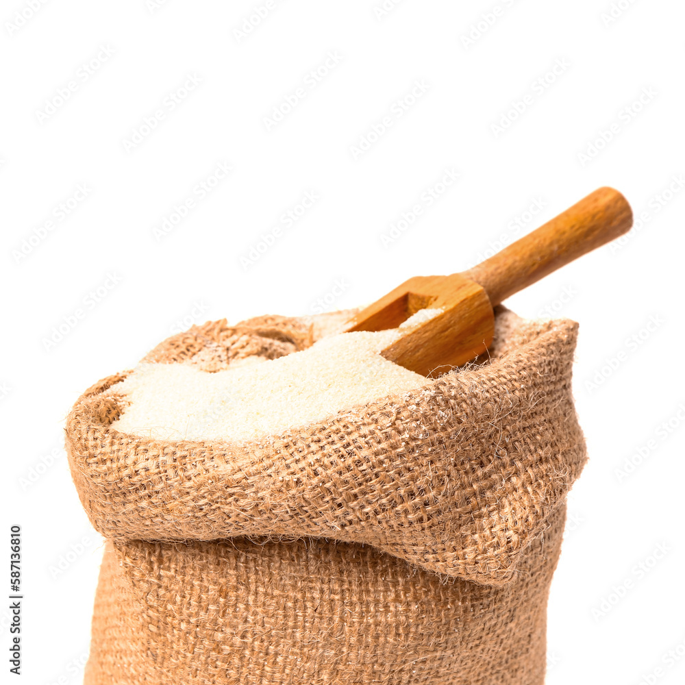 Sack bag with raw semolina on white background, closeup