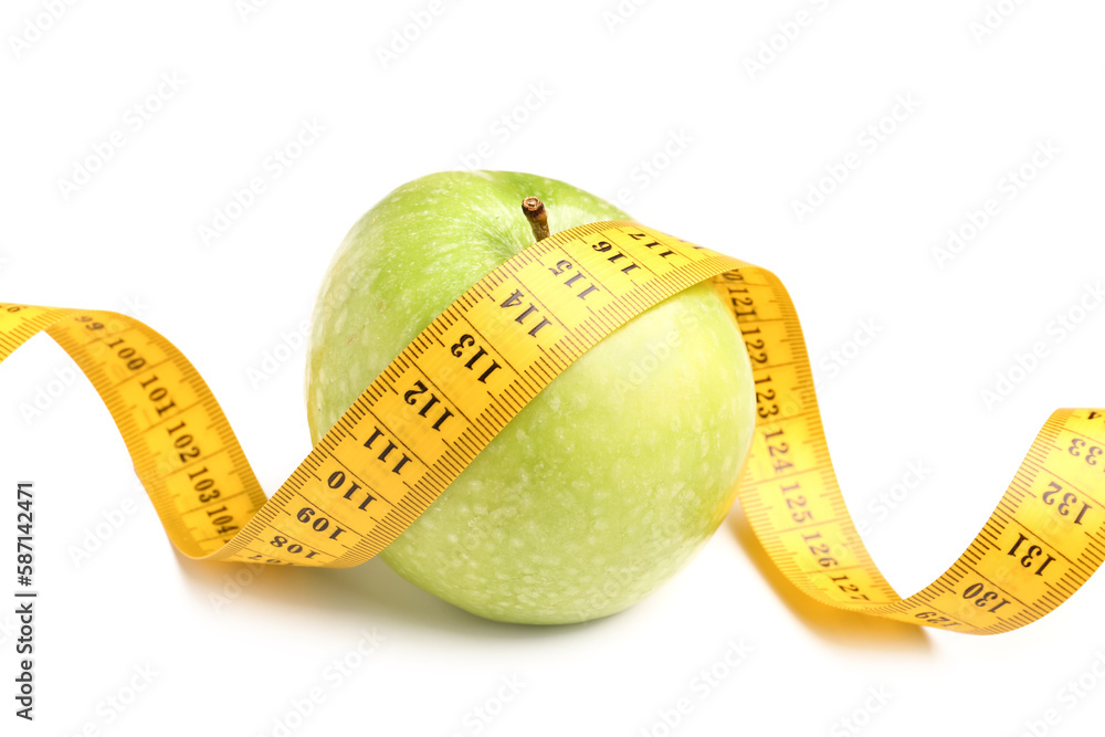 Apple and yellow measuring tape on white background. Diet concept