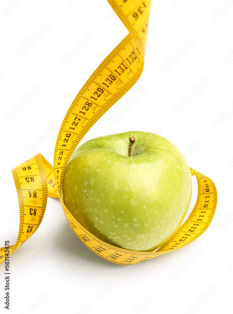 Apple and yellow measuring tape on white background. Diet concept