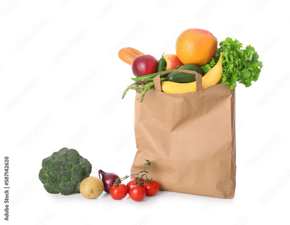 Paper bag with vegetables and fruits on white background