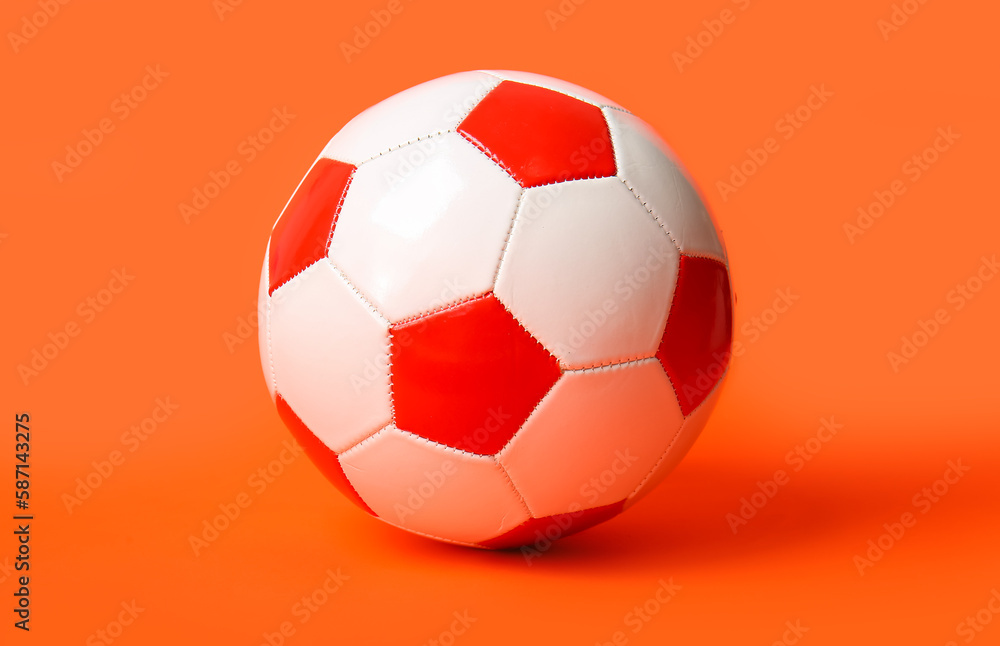 Soccer ball on orange background