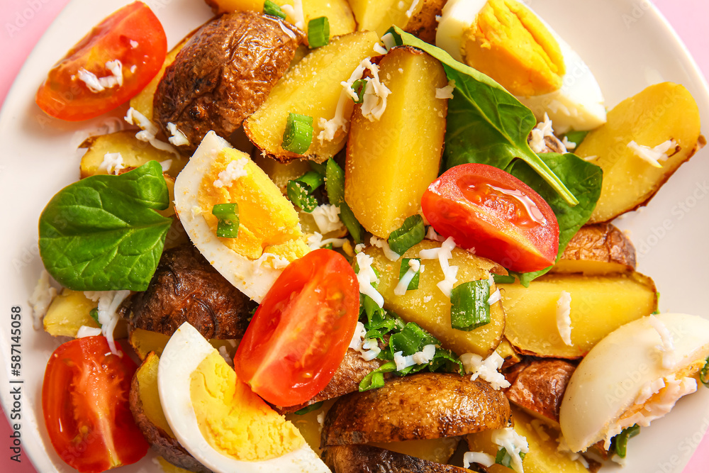 Plate of tasty potato salad with eggs and tomatoes, closeup