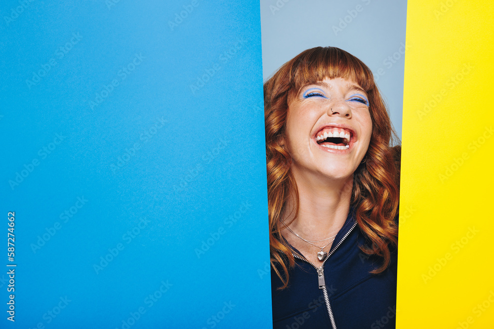 Young woman laughing in an art and design studio