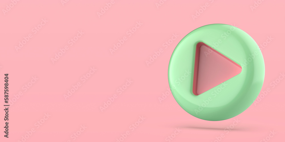 Green plastic play button on pink background