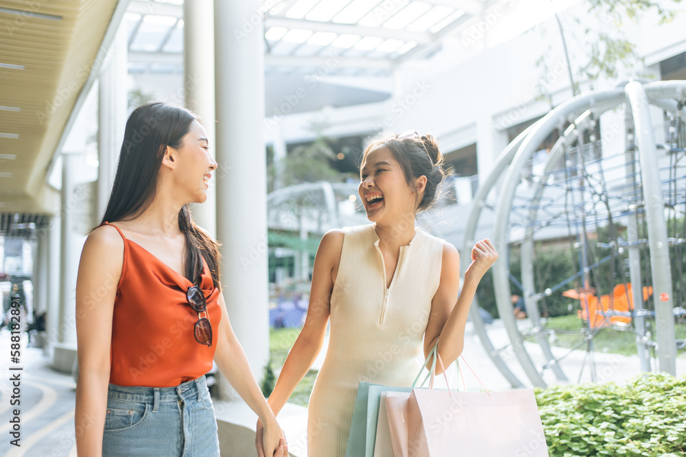 Asian young two woman shopping goods outdoors in department store. 