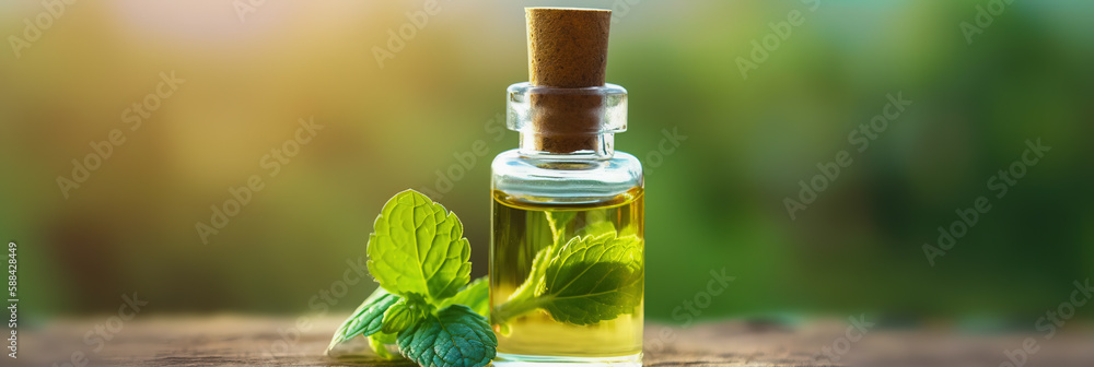 Essential oil extract of medicinal herbs in a small glass bottle. Peppermint. Selective focus. natur