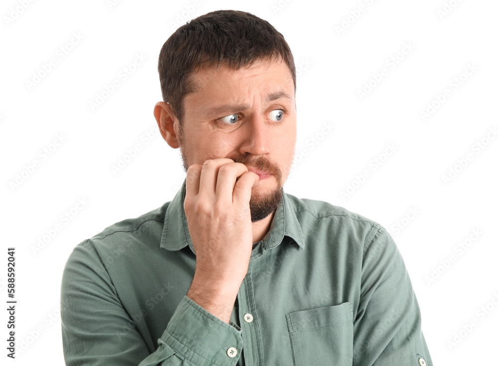 Handsome man in shirt biting nails on white background, closeup