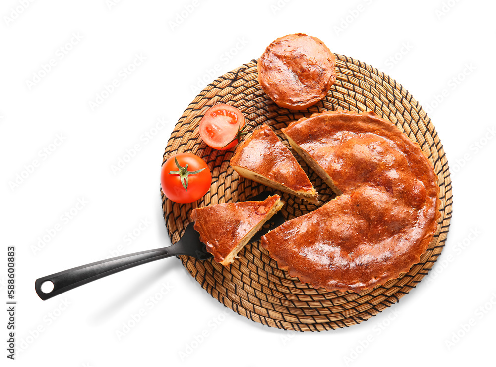 Wicker mat with delicious meat pies and tomatoes isolated on white background