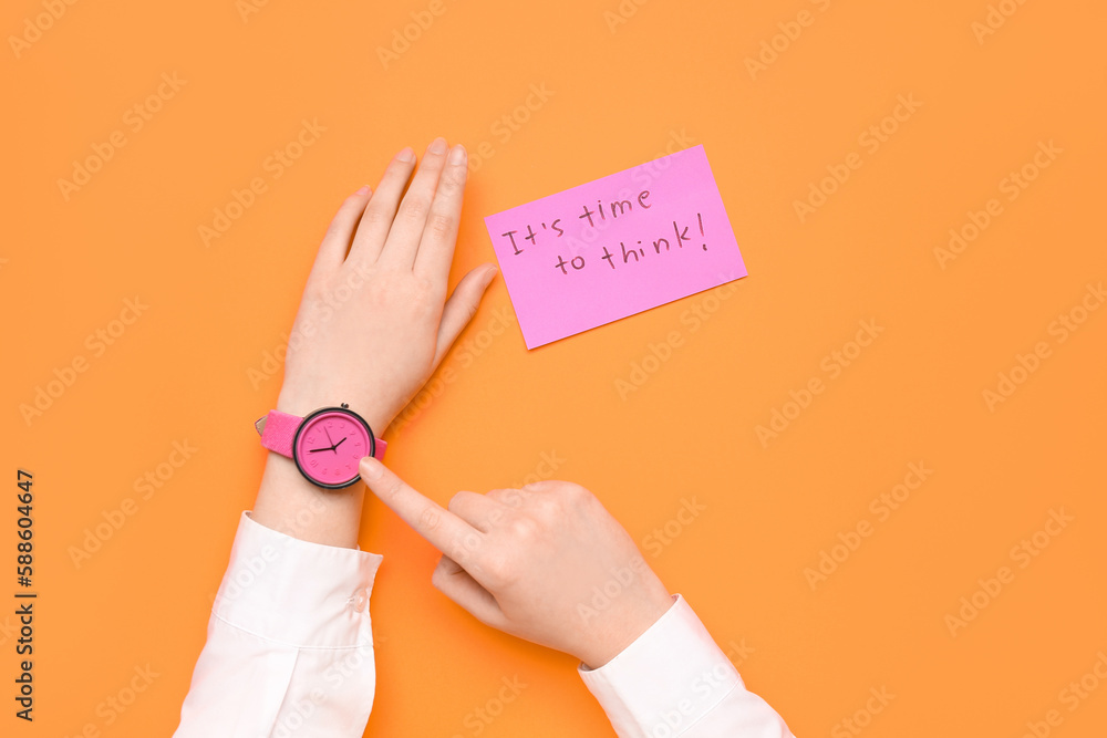 Woman pointing at wristwatch and paper with text ITS TIME TO THINK on red background