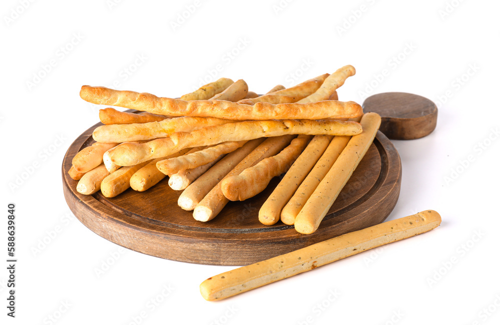 Wooden board with tasty Italian Grissini isolated on white background