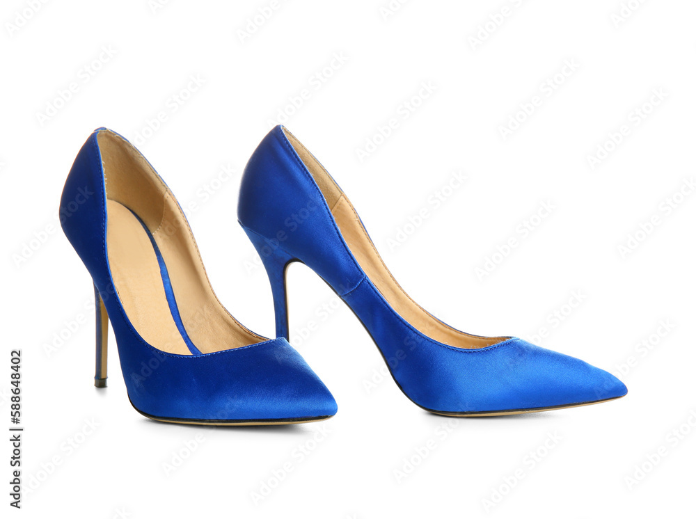 Pair of blue high heeled shoes on white background