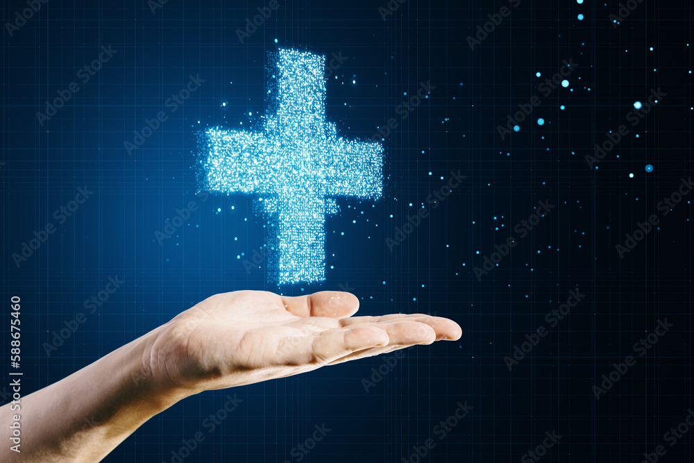 Close up of female hand holding creative glowing medical cross plus hologram on dark background. Hea