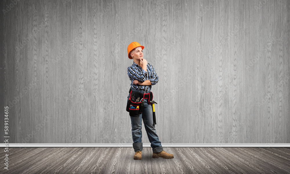 Concentrated female engineer in hardhat