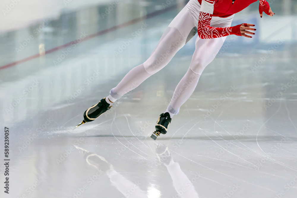 slim female skaters run race in speed skating competition, winter sports games