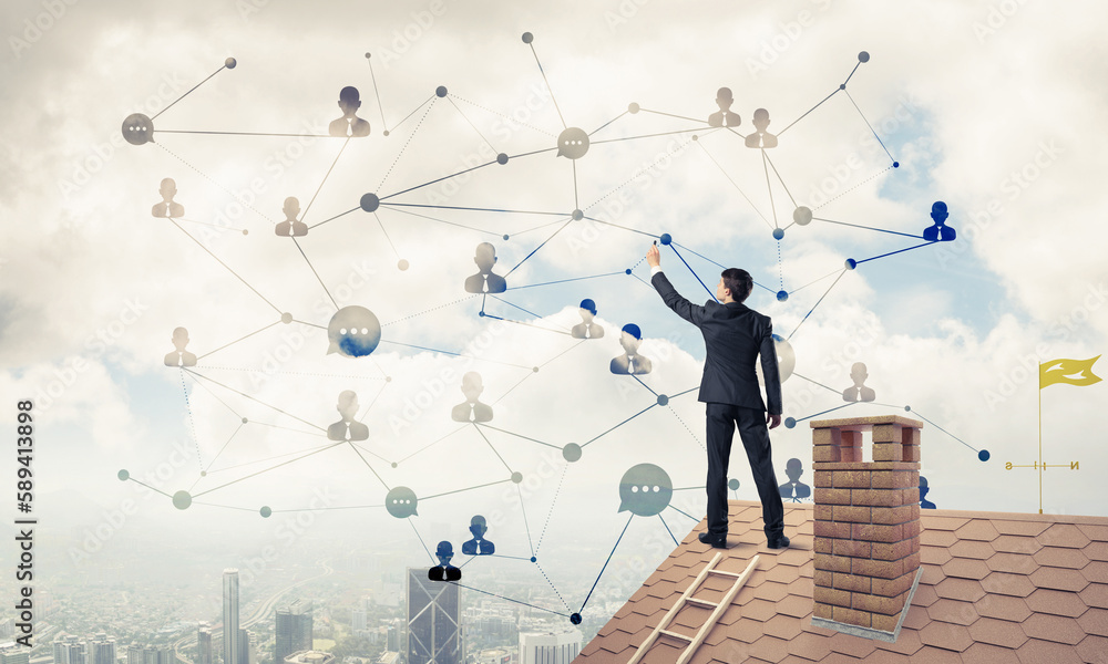 Businessman on house roof presenting networking and connection c