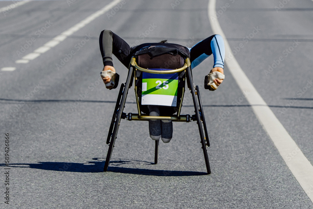 para athlete in wheelchair riding road marathon race, movement uphill overpass, para athletics compe