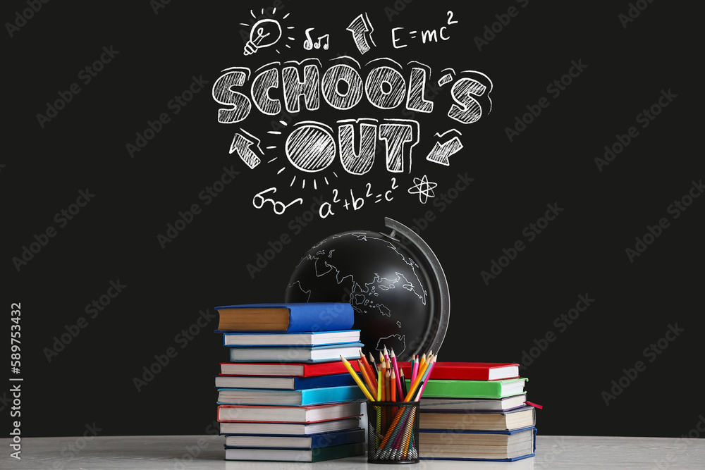 Stack of books, stationery and globe against blackboard with text SCHOOLS OUT