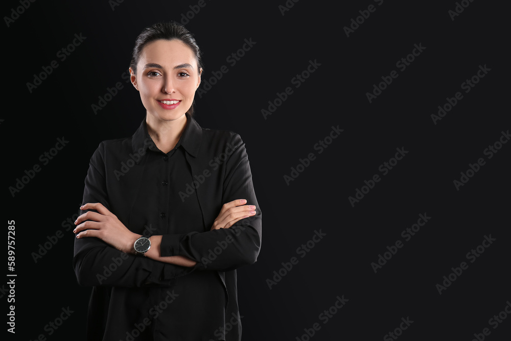 Female business consultant on dark background