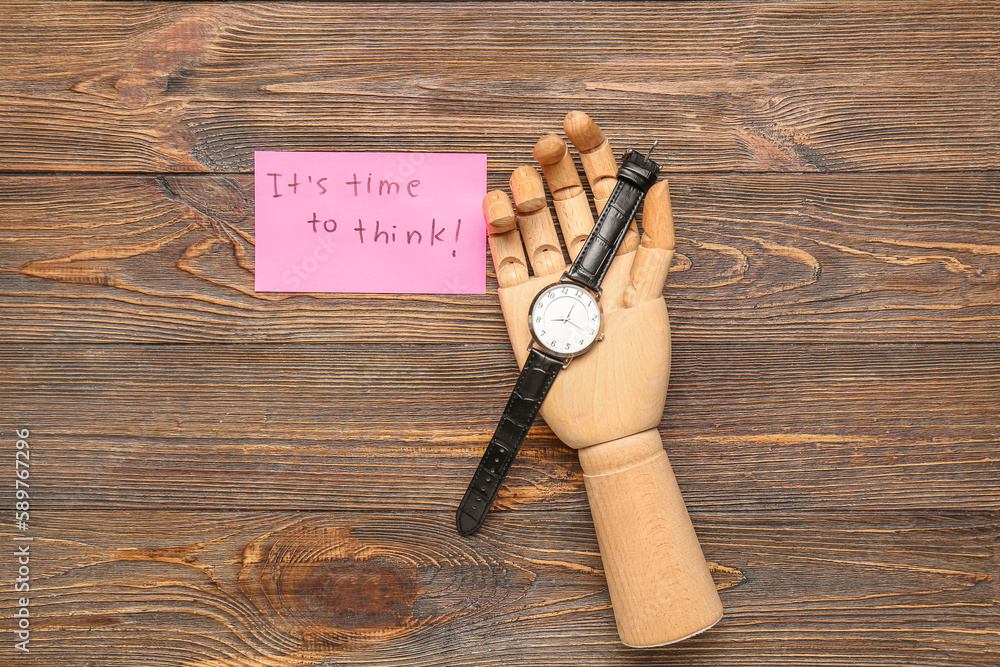 Paper with text ITS TIME TO THINK, hand and wristwatch on wooden background. Insight concept