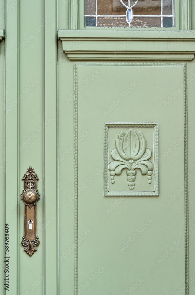 View of beautiful green door in city, closeup