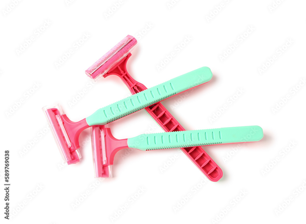 Colorful safety razors on white background